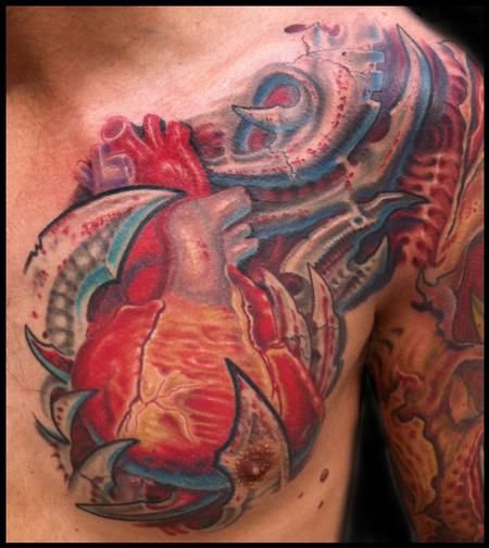 Phil Robertson - anatomical heart and bio mech tattoo